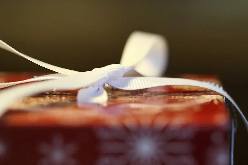 A present tied with white ribbon