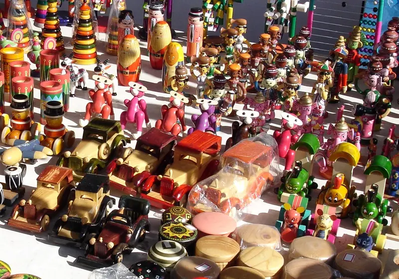 Rows of brightly painted wooden toys
